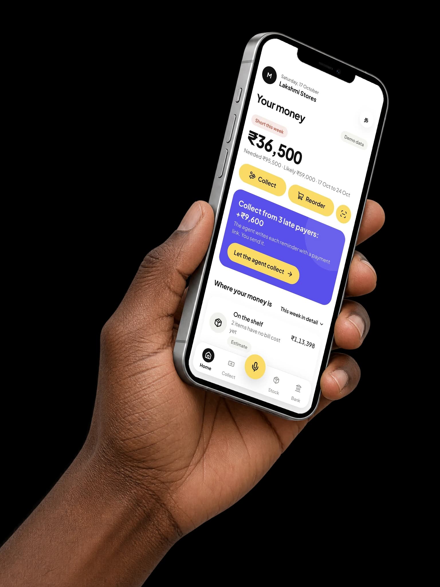 The shop app on a phone, held in a hand: this week short by ₹36,500, with three late payers to collect from